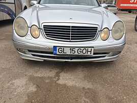 Bara Spoiler Fata cu Grile Proiectoare cu Bandouri cu Locas Senzori de Parcare si Locas Spalatoare Faruri cu Defecte Mercedes Clasa E Class W211 Break Combi NFL Non Facelift 2002 - 2006 Culoare C775 775 [K3437] [K3438] [K3439] [K3440] [K3441] [K3442] [K34
