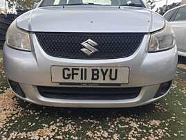 Bara Spoiler Fata Completa FARA Grila Emblema Suzuki SX4 Sedan 2007 - 2014 Culoare ZMU [Q4450]