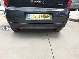 Bara Spoiler Spate cu Locas Pentru Senzori de Parcare cu Imperfectiuni Fiat Doblo 2 2009 - 2015 Culoare Negru [Q4796]
